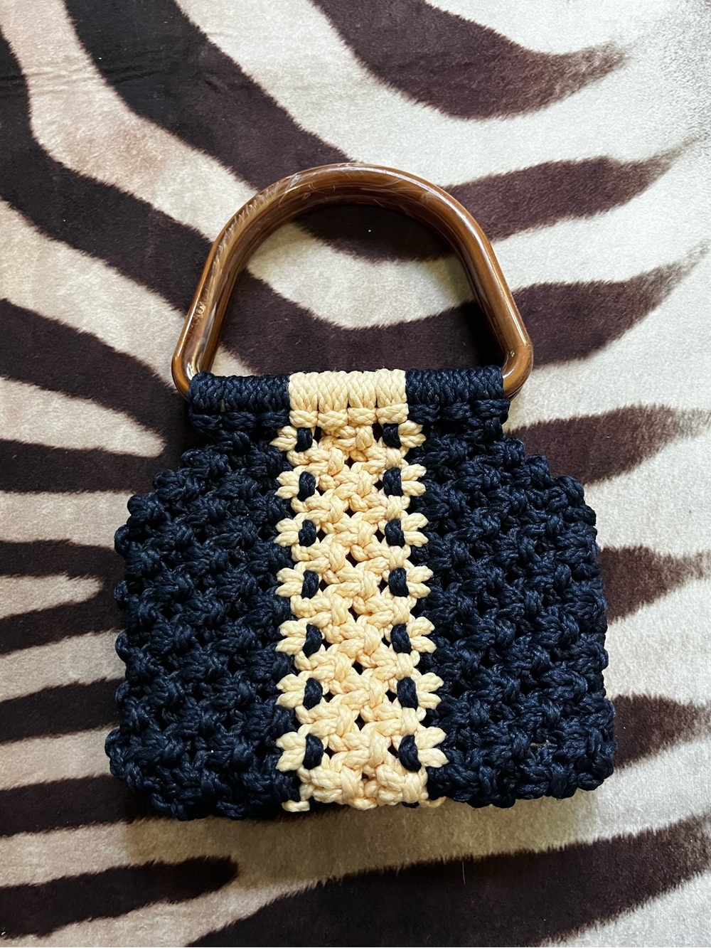 Handwoven Navy and Beige Crochet Tote with Brown Marbled Handles.